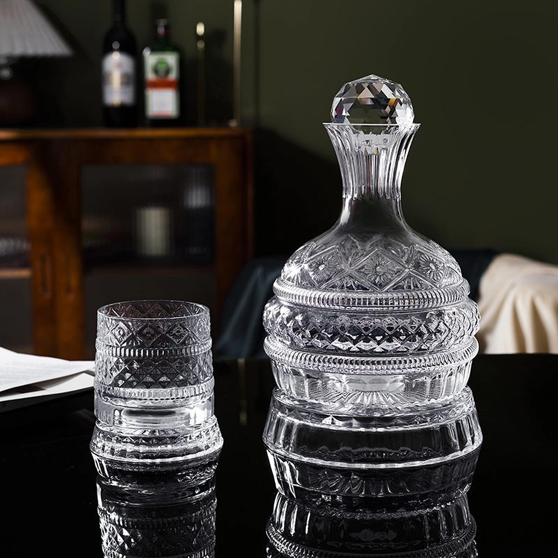 Red wine poured into a lead-free crystal decanter beside a matching glass, made by Yukun Glassware